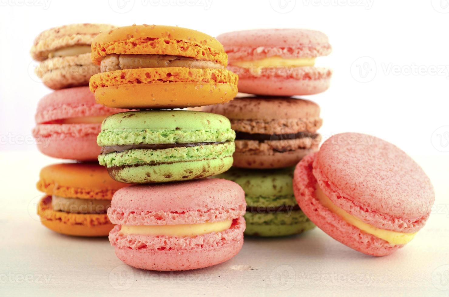 Colorful strawberry, caramel and chocolate mint macaroons photo