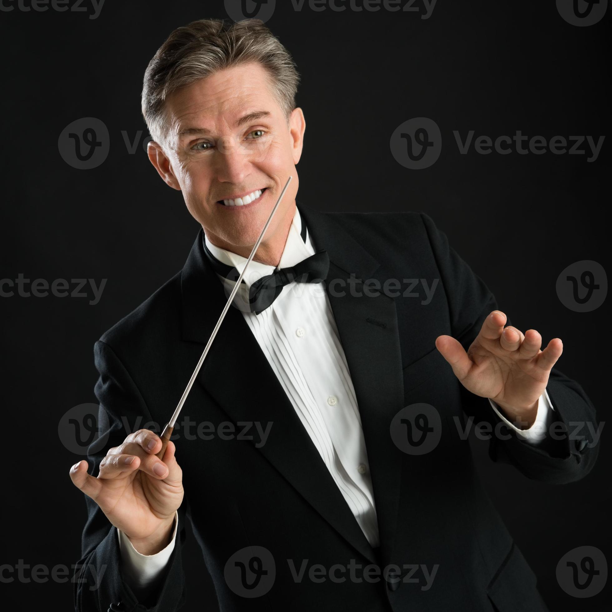 Happy Music Conductor Gesturing While Directing With His Baton 859156