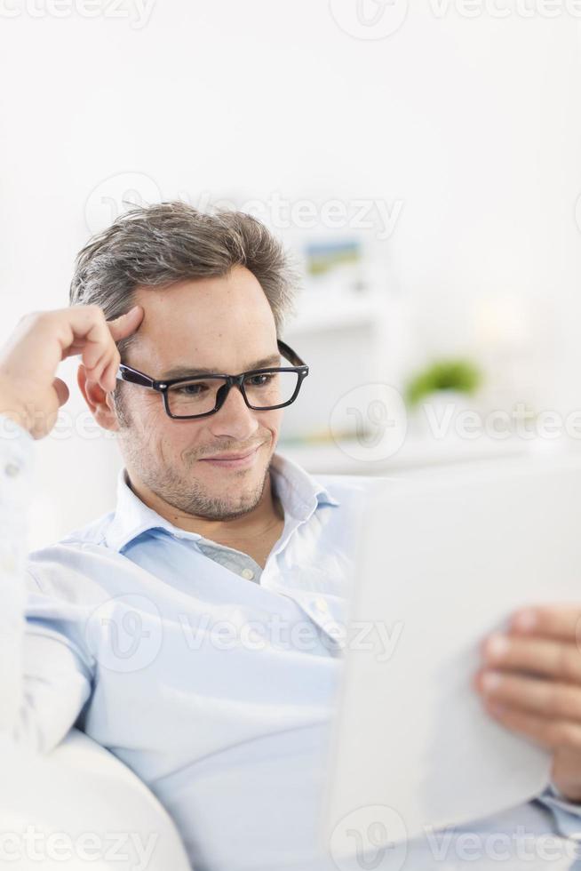 handsome man using a digital tablet photo