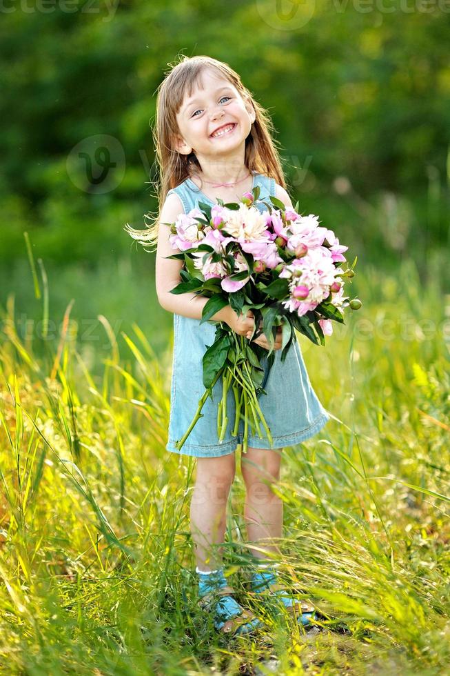 portrait of little girl outdoors in summer photo