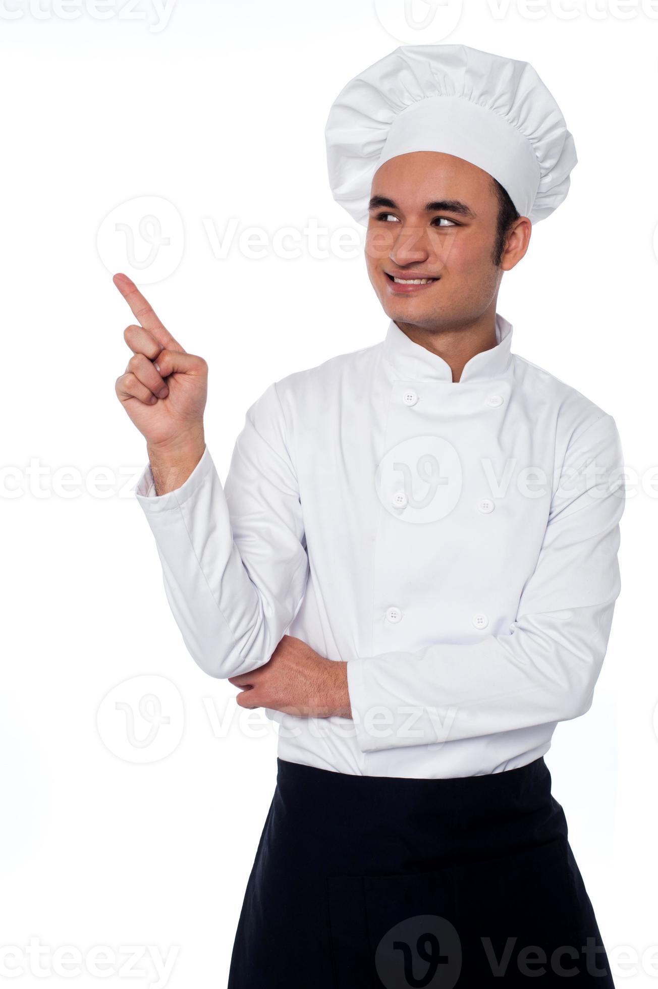 Male chef looking and pointing away photo
