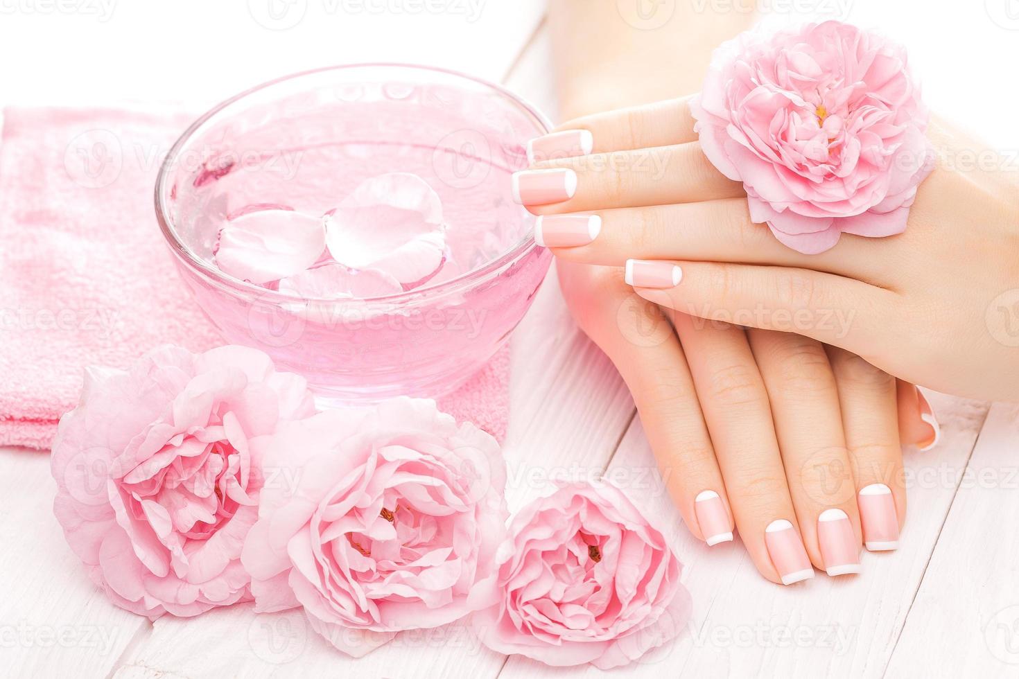 french manicure with rose flowers. spa photo