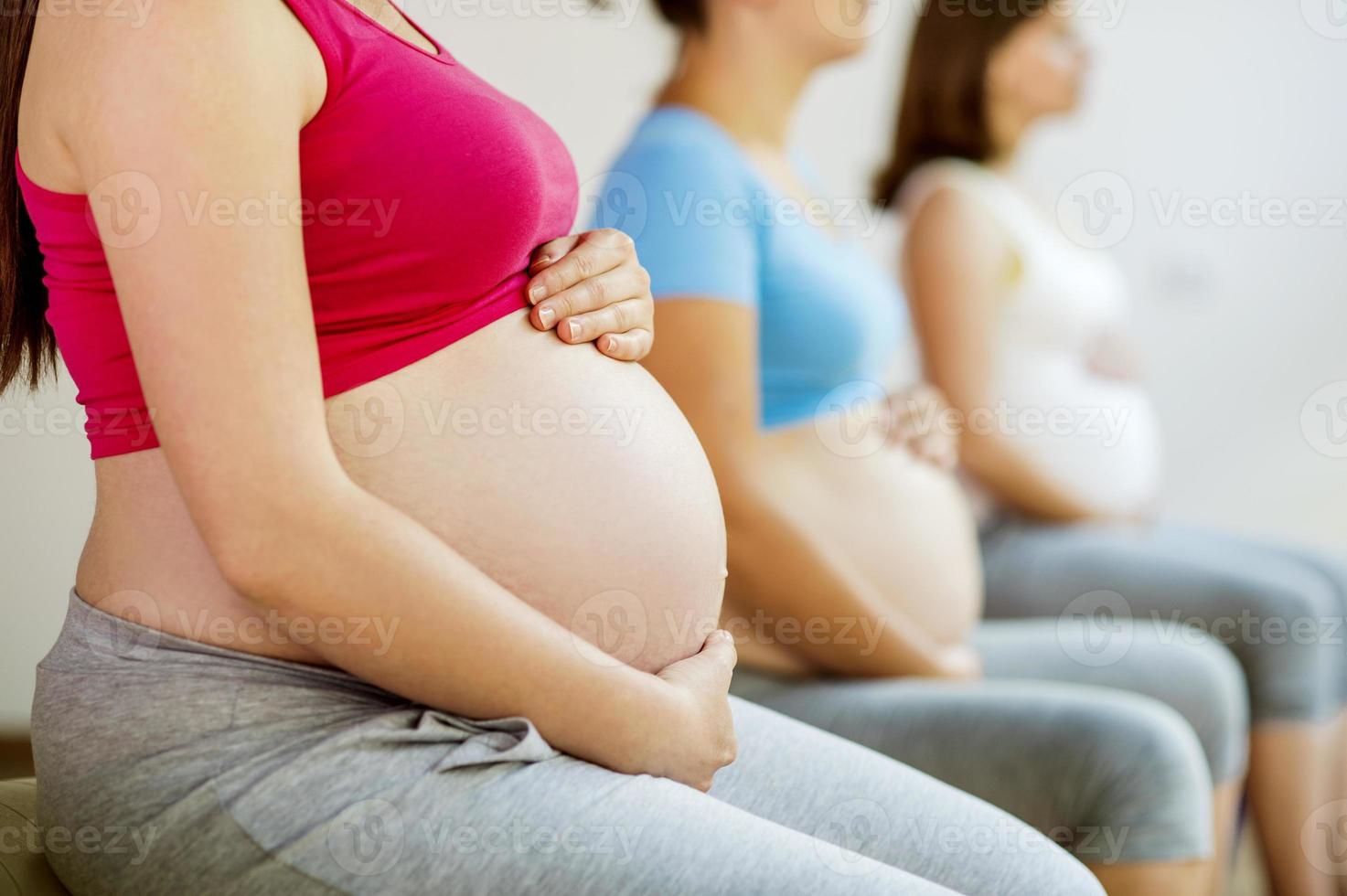 Pregnant women exercising photo