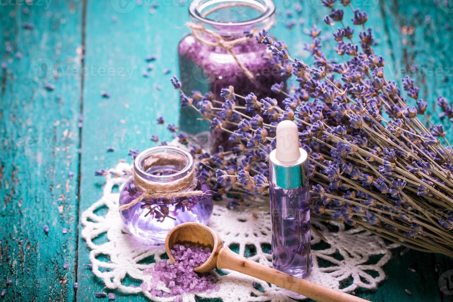 lavender flower,oil,salt, spa beauty concept. wood old background. photo