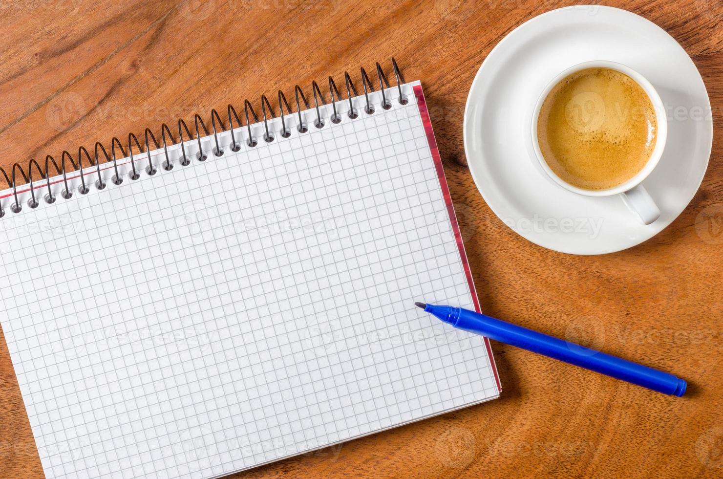 Blank notepad with pen and espresso photo