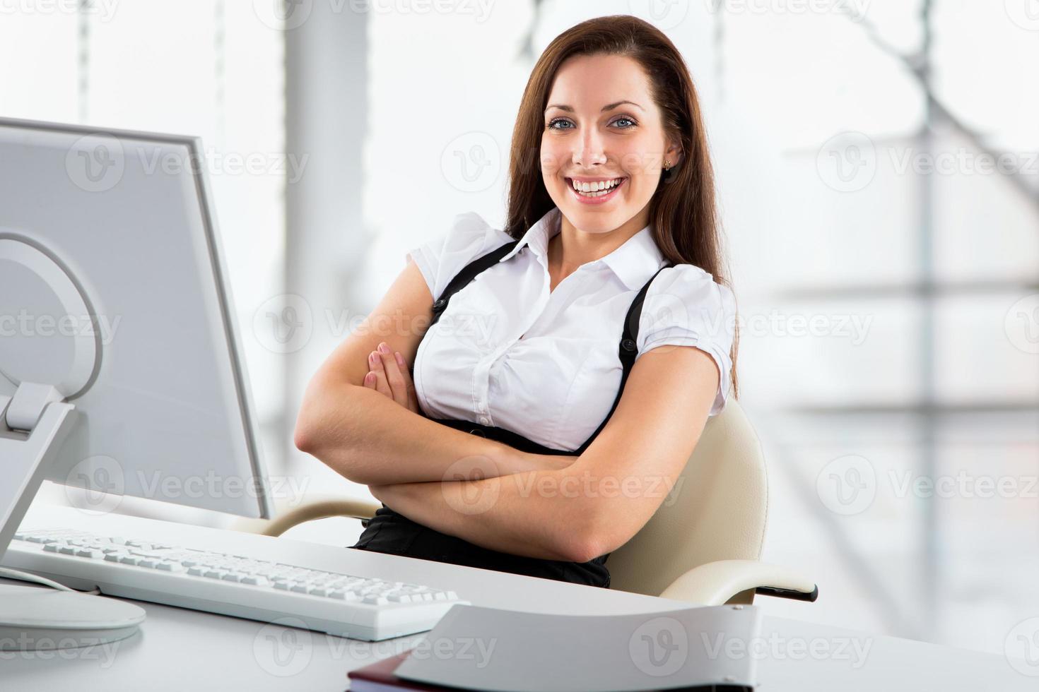 Business woman working with laptop photo