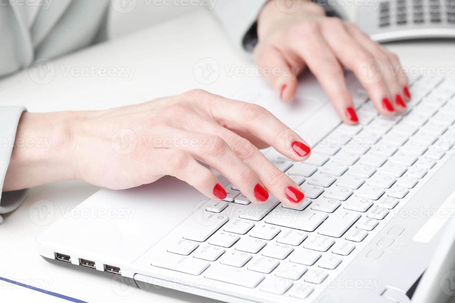 Businesswoman working on laptop. photo