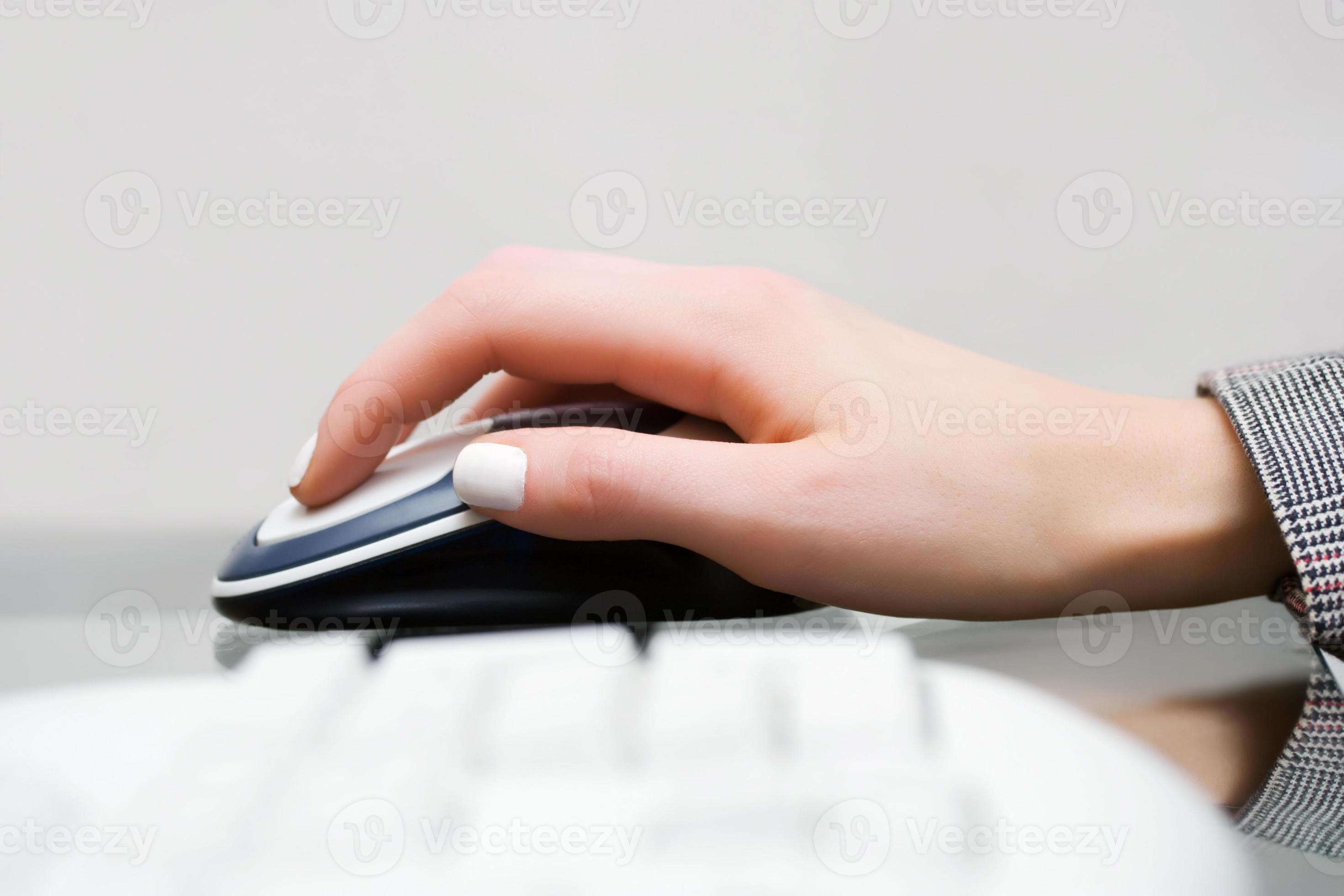 Female hand holding computer mouse 876114 Stock Photo at Vecteezy