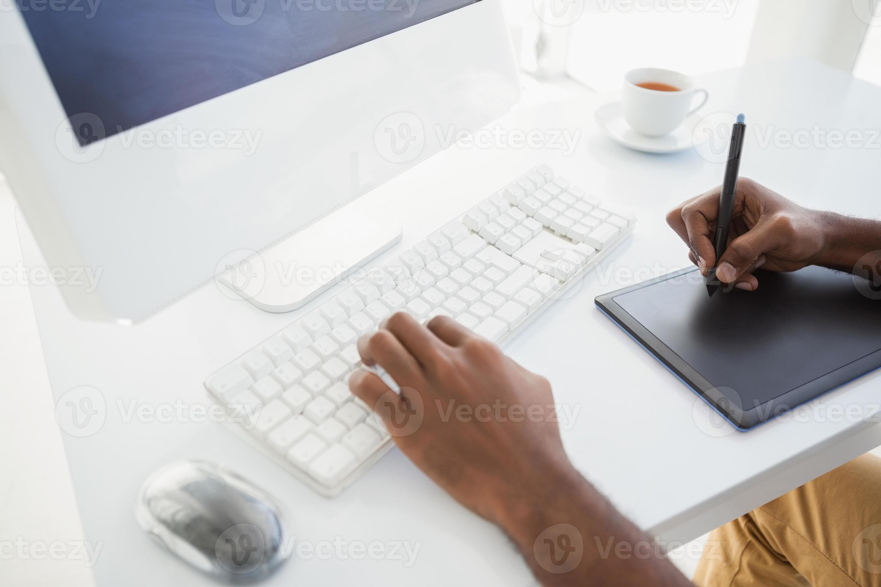 Businessman using computer and digitizer 876159 Stock Photo at Vecteezy