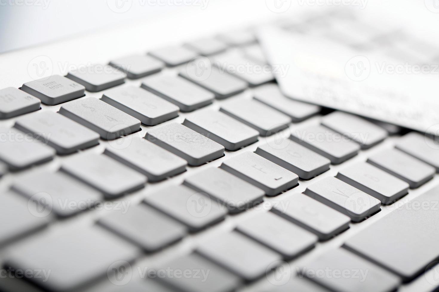 Credit card on a computer keyboard photo