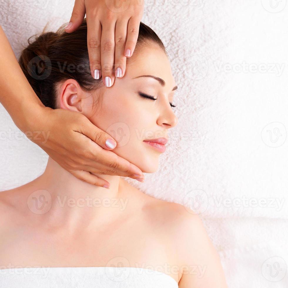 Woman having massage of body in spa salon photo