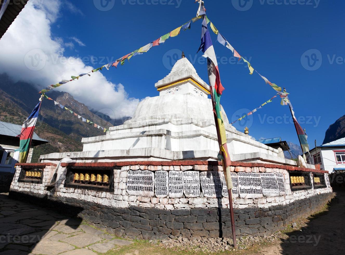 Stupa with prayer flags photo