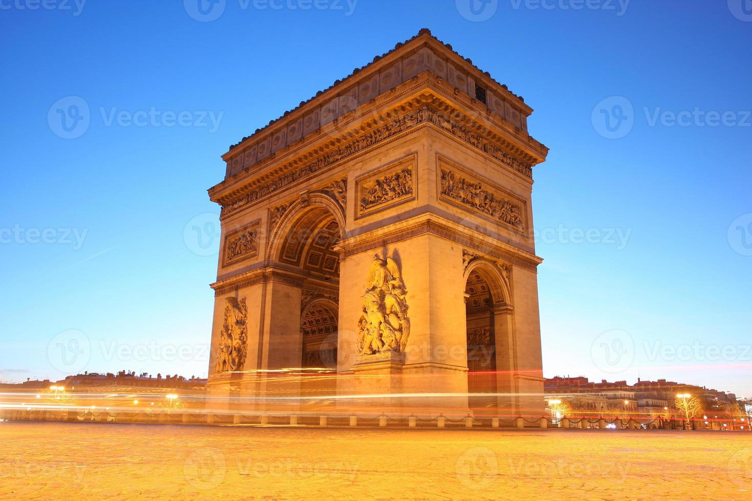 Famous Arc de Triomphe in the evening, Paris, France photo