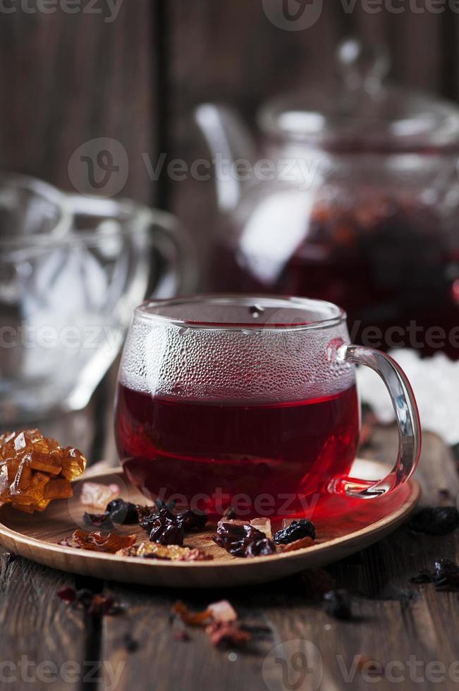 Red hot tea on the wooden table photo
