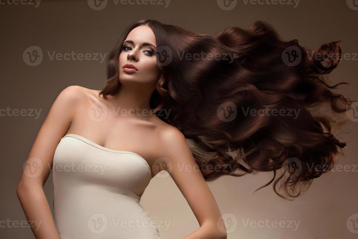 Portrait of Beautiful Woman with Long flying Hair. photo