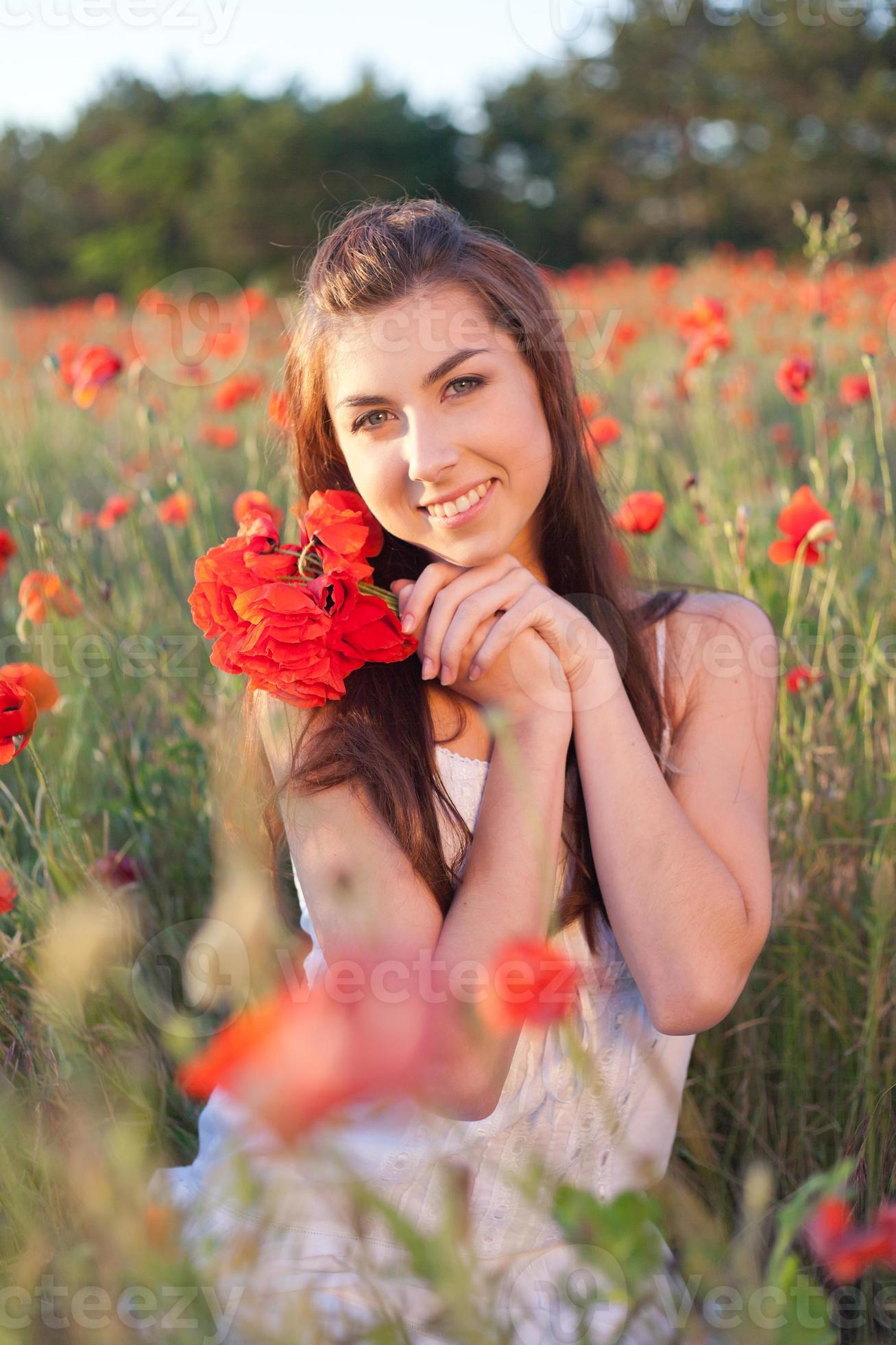 Young Woman Cuddling Bouquet Of Red Poppies Enjoying Nature Stock Photo Young Woman Cuddling Bouquet Of Red Poppies Enjoying Nature Stock Photo
