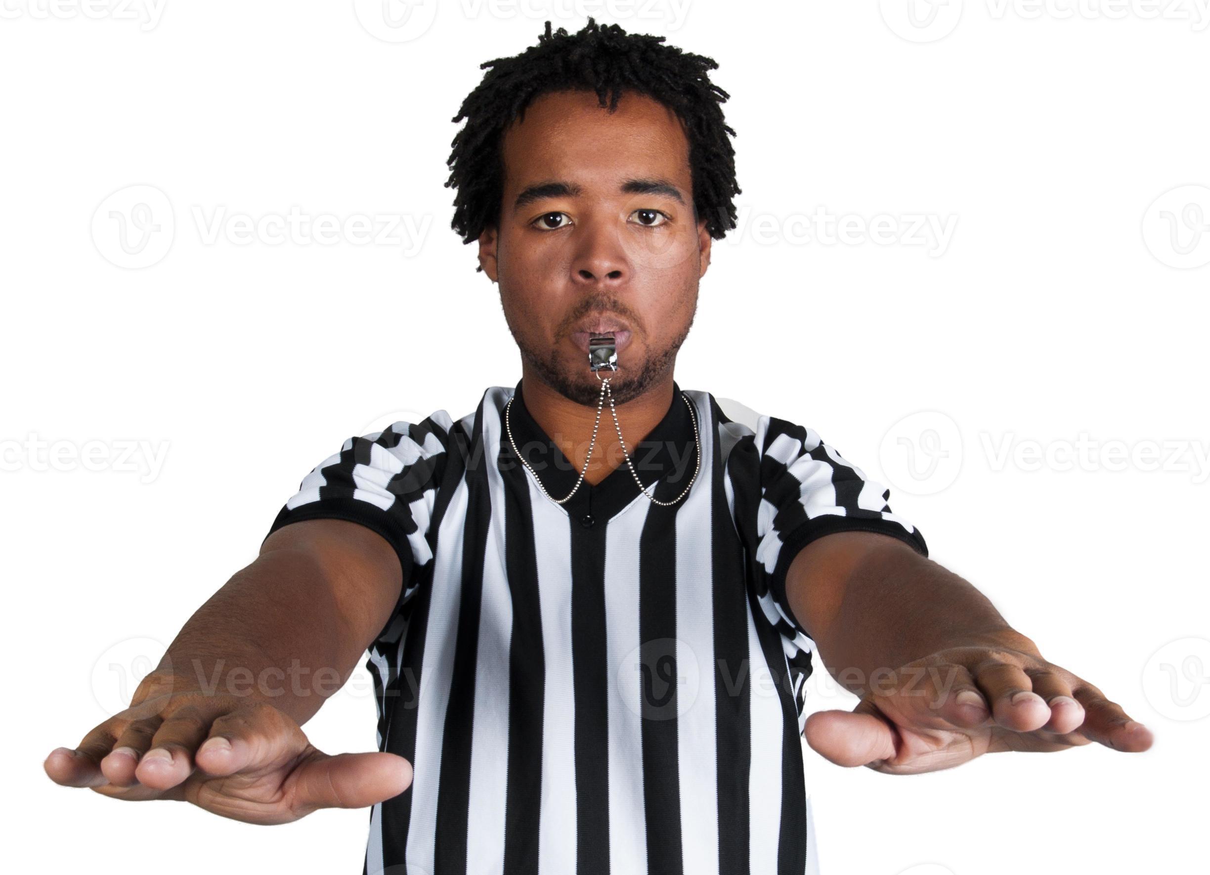 Black Male Referee Blowing a Whistle and Calling a Violation 885161