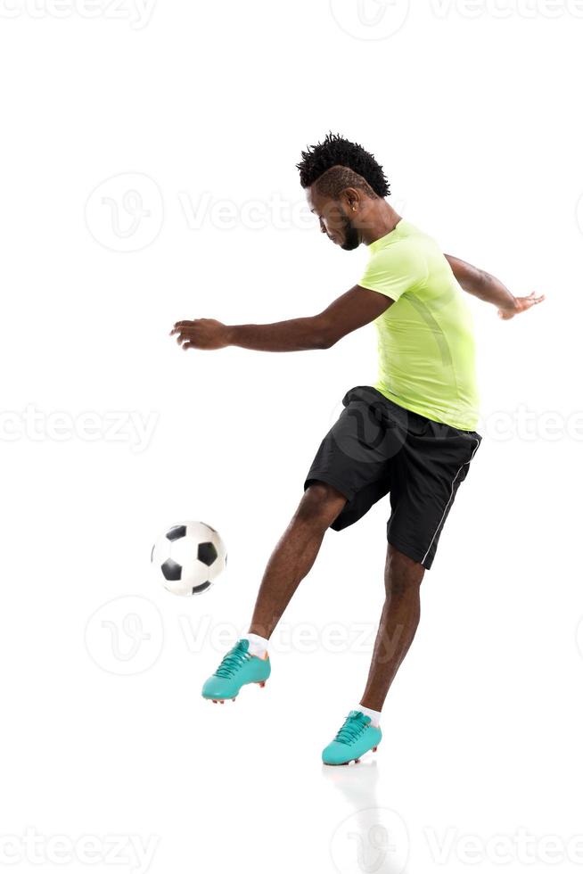 Kicking soccer ball photo