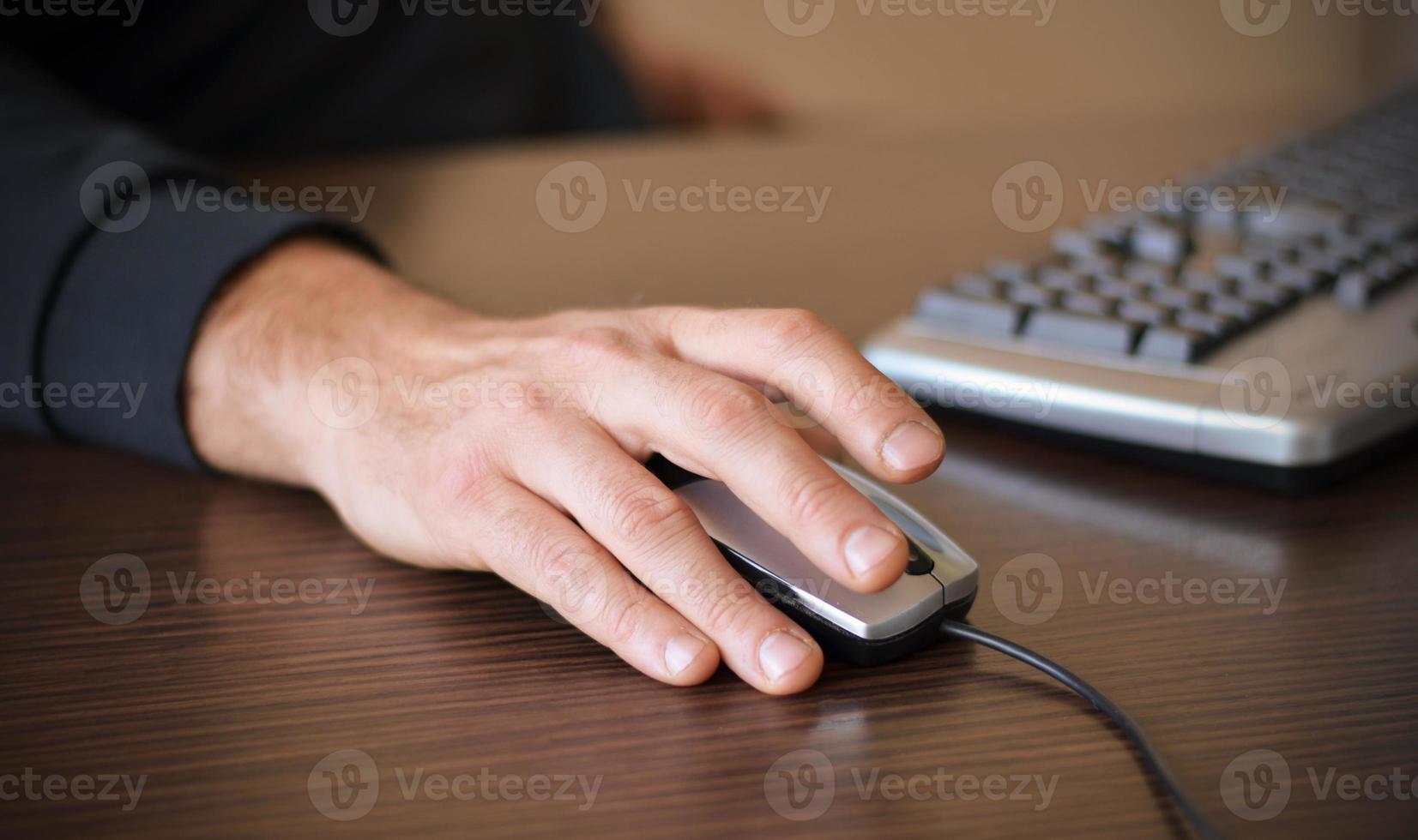 Male hand on mouse photo