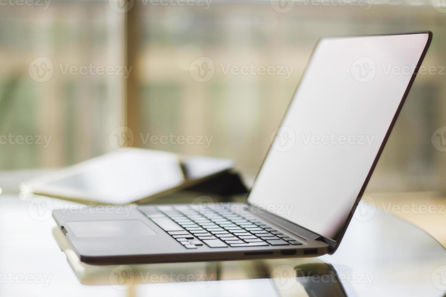 laptop on table at home, shallow depth of field photo