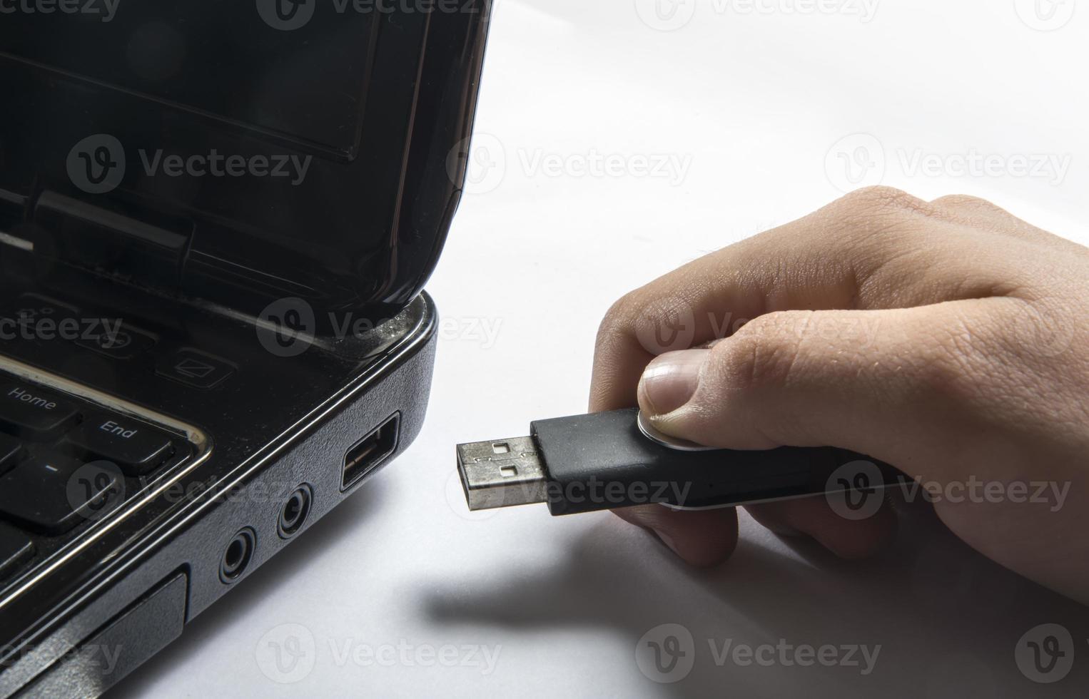 Hand inserting usb memory stick to laptop computer 886895 Stock Photo