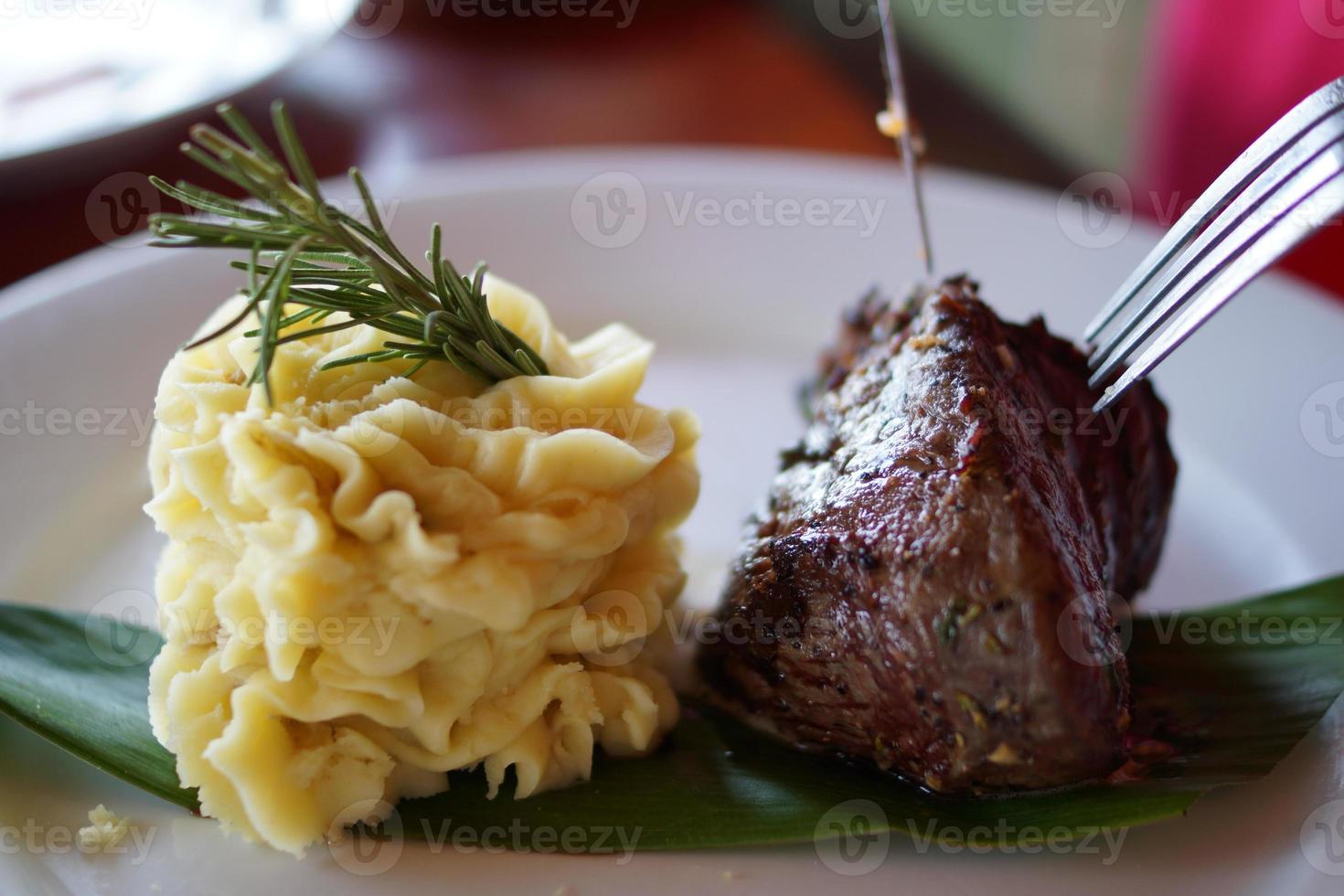 Steak and mashed potatoes photo