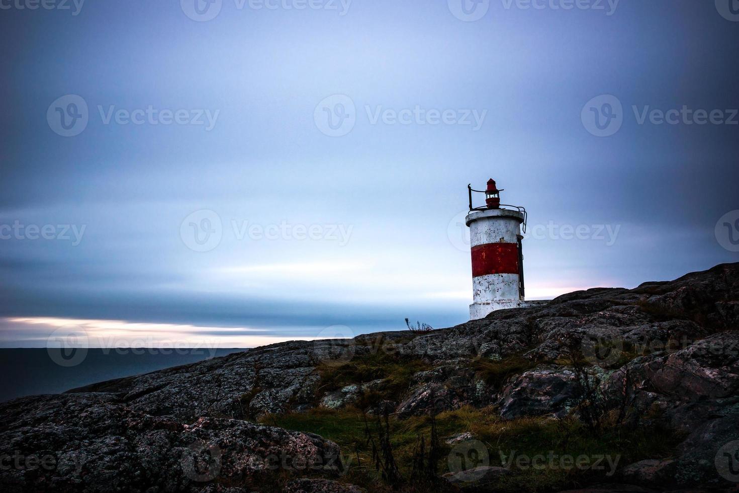 Small lighthouse in sunrise photo