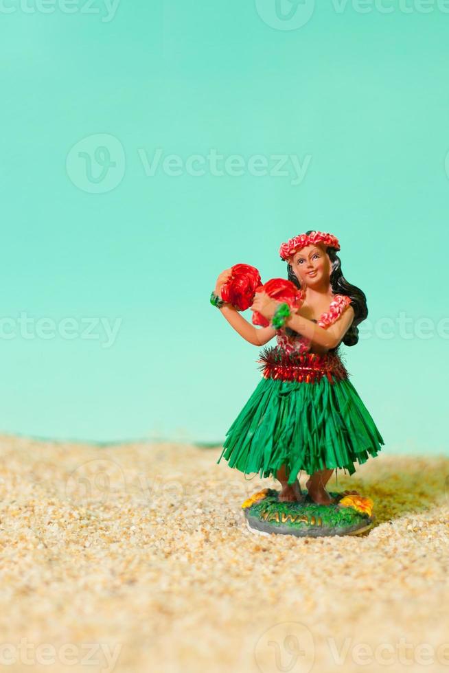 Hula Girl Toy on Beach photo