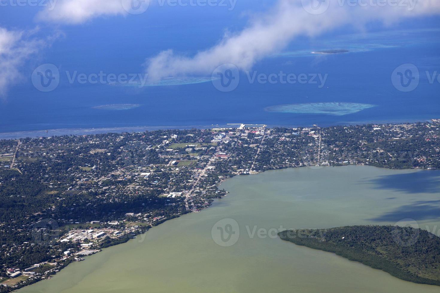 Aerial photograph of Nuku'alofa with ocean in the distance photo