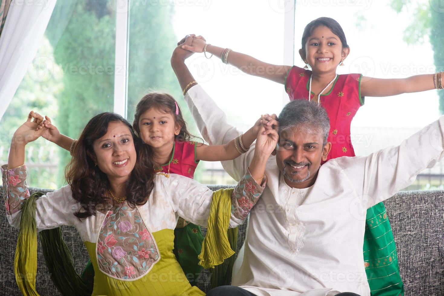 Happy Indian family at home 891836 Stock Photo at Vecteezy