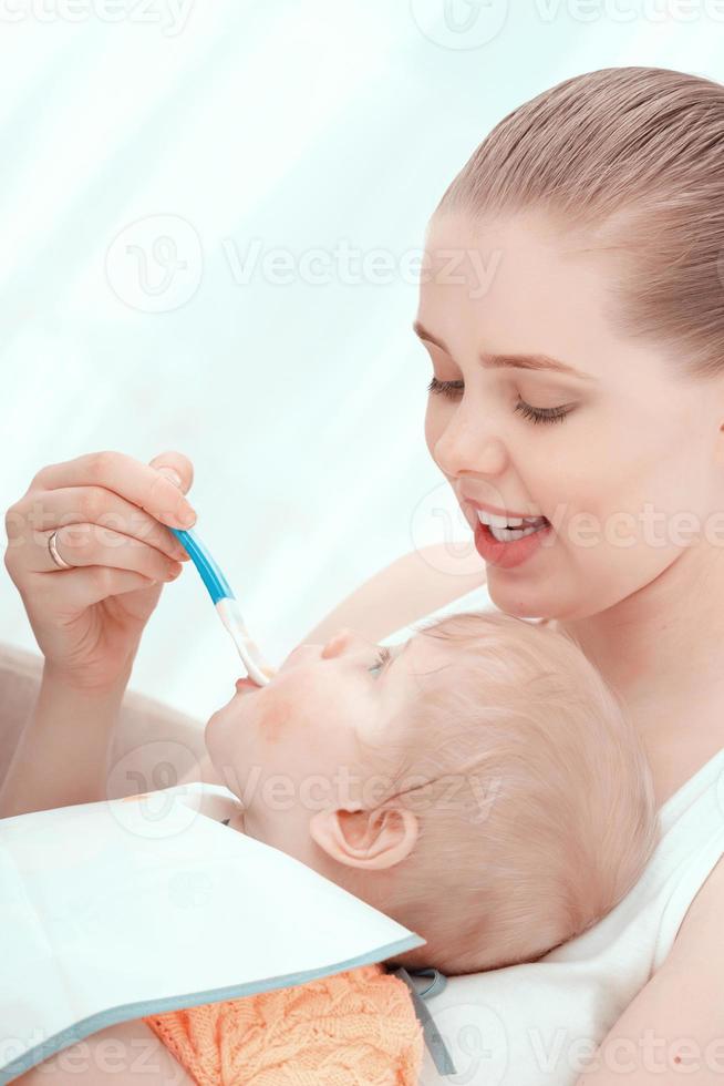 Mother feeding her baby photo