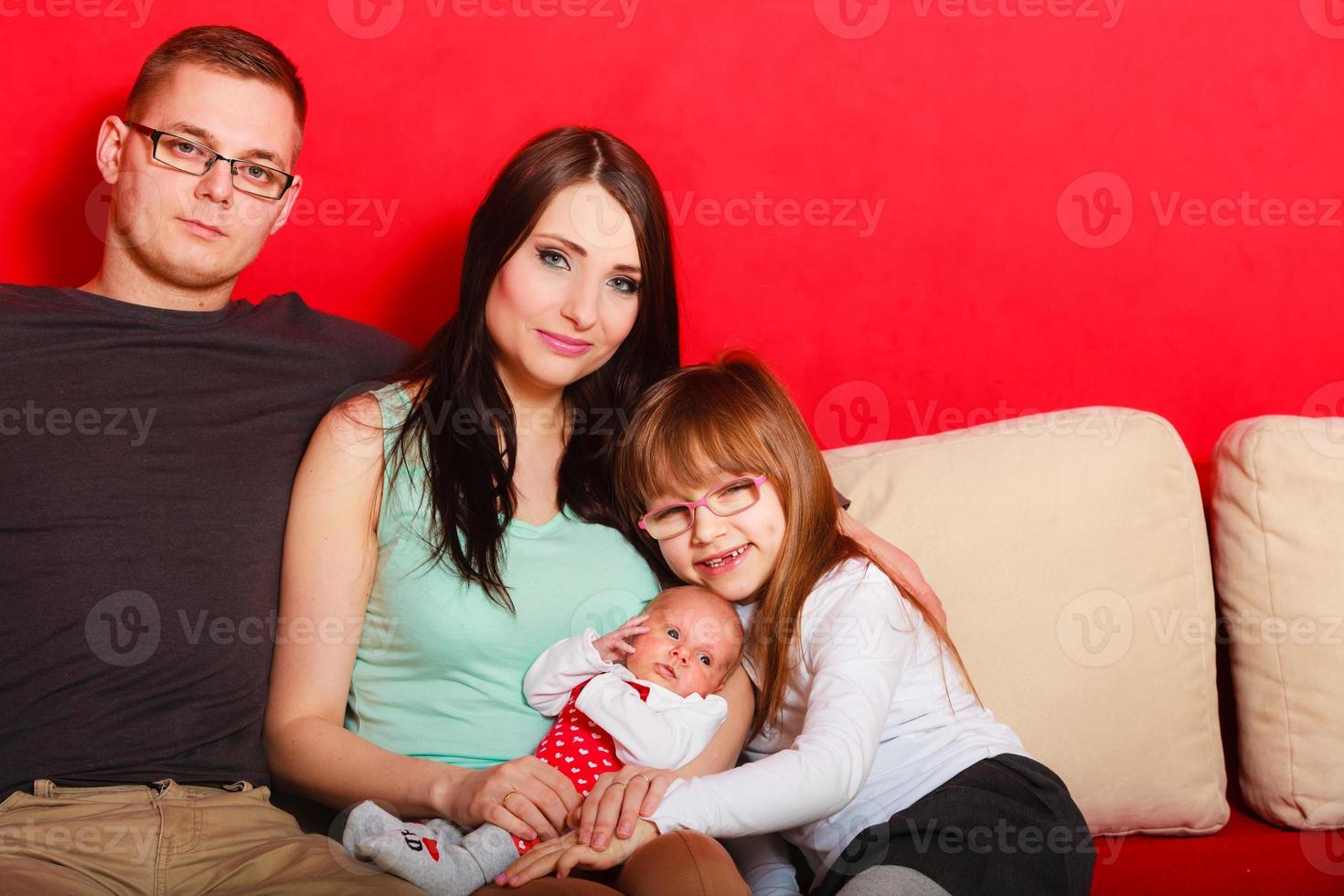 Family with newborn baby girl portrait photo
