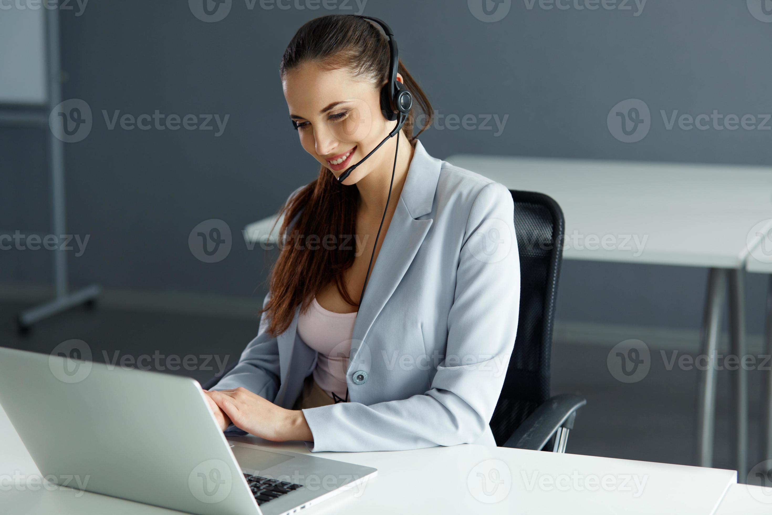 Call Center Operator Sitting Infront of Her Computer photo