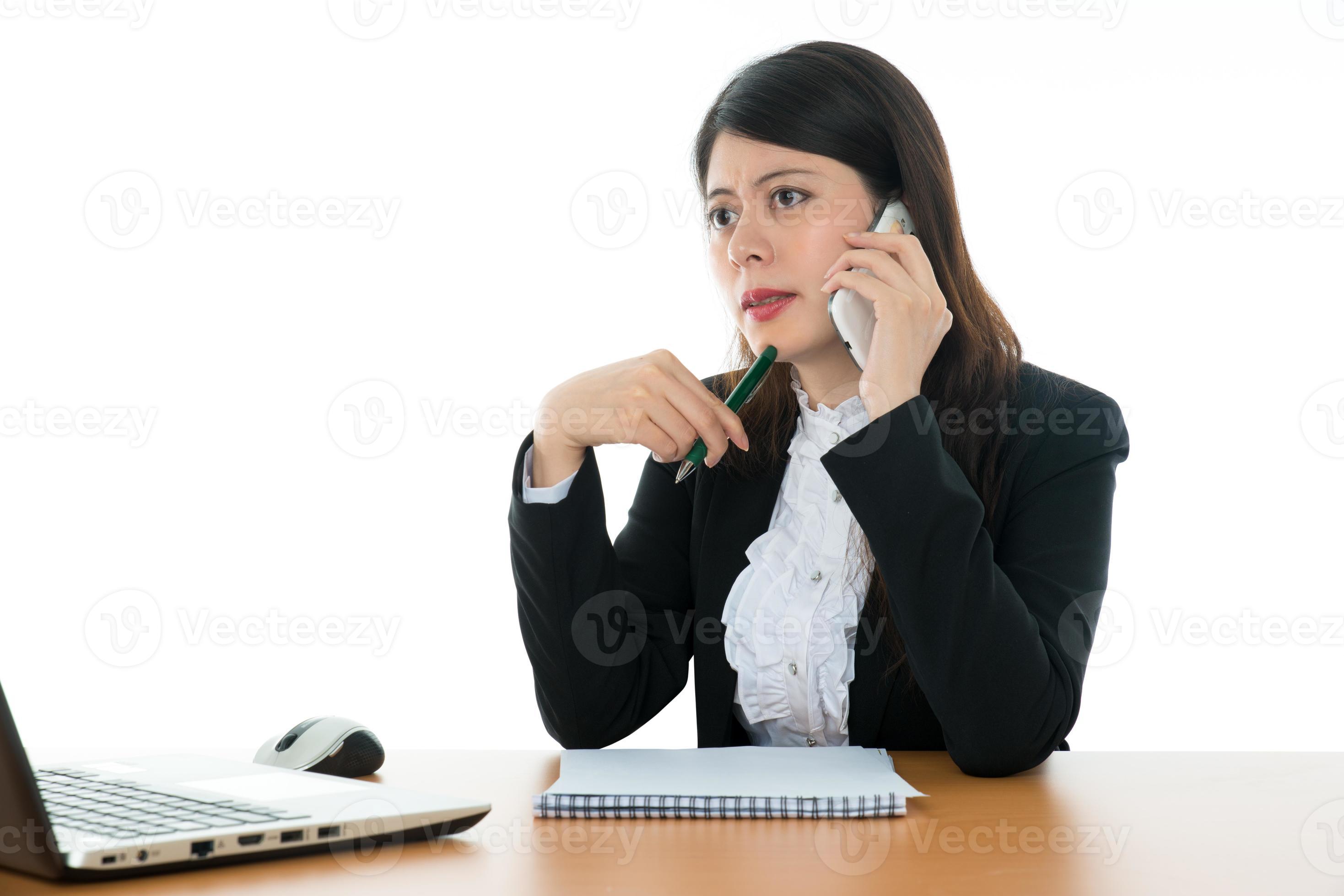 Businesswoman Sitting At Office Desk photo