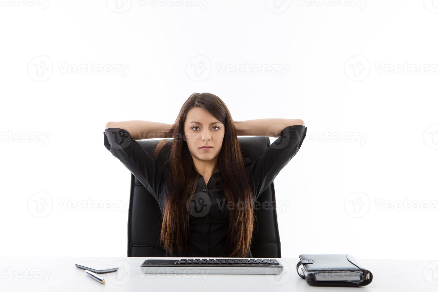 business woman sitting at her desk photo