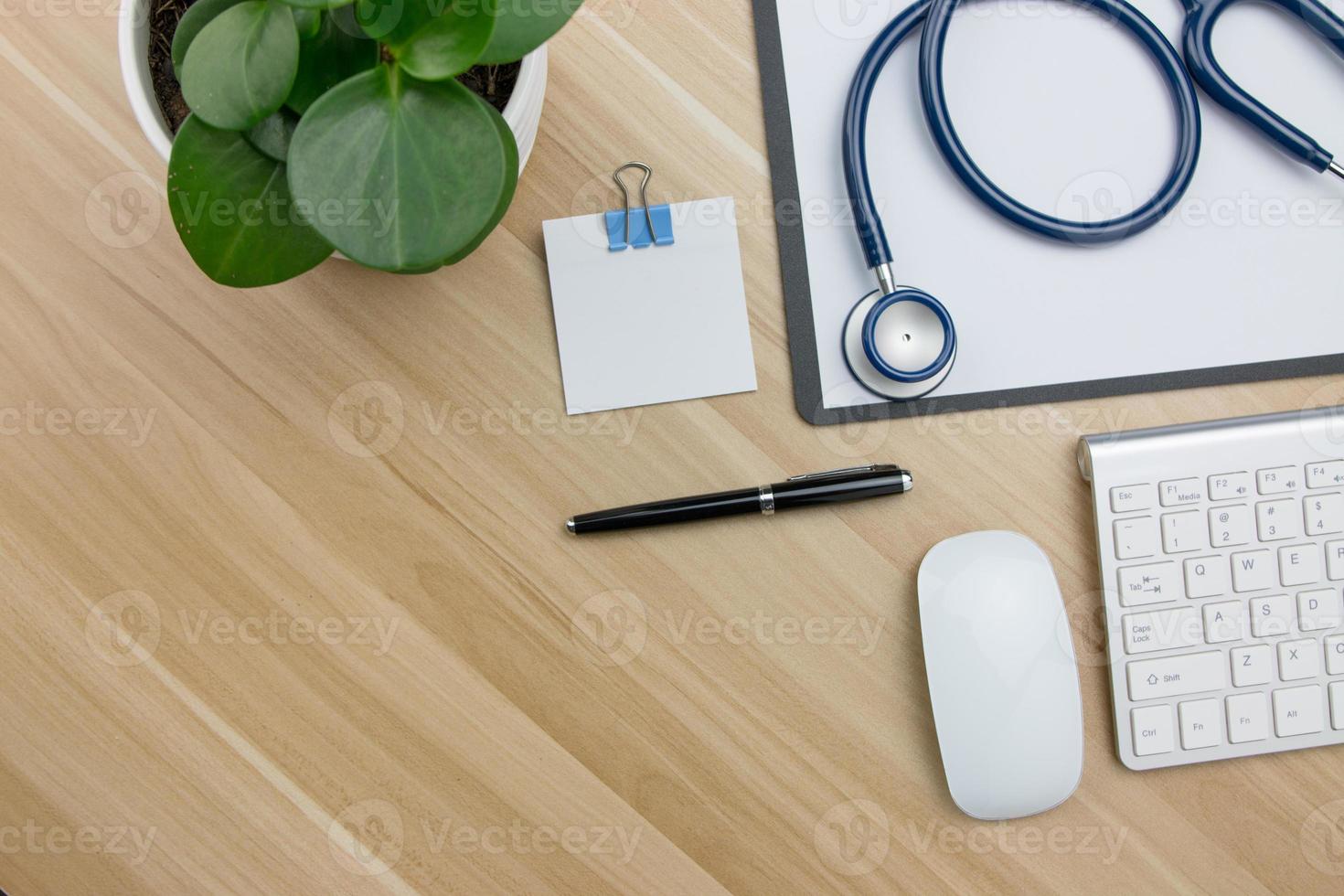 Stethoscope in doctors desk photo