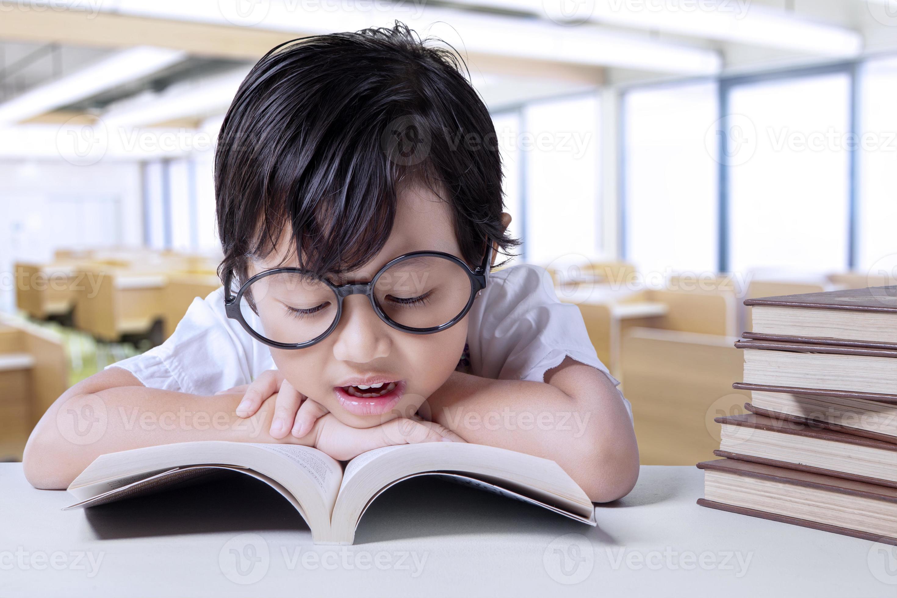 little-student-enjoy-read-books-in-class-901671-stock-photo-at-vecteezy