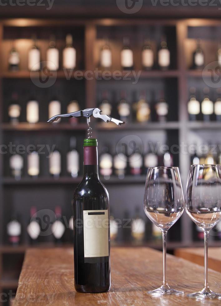 Wine Bottle with Two Glasses and Corkscrew photo