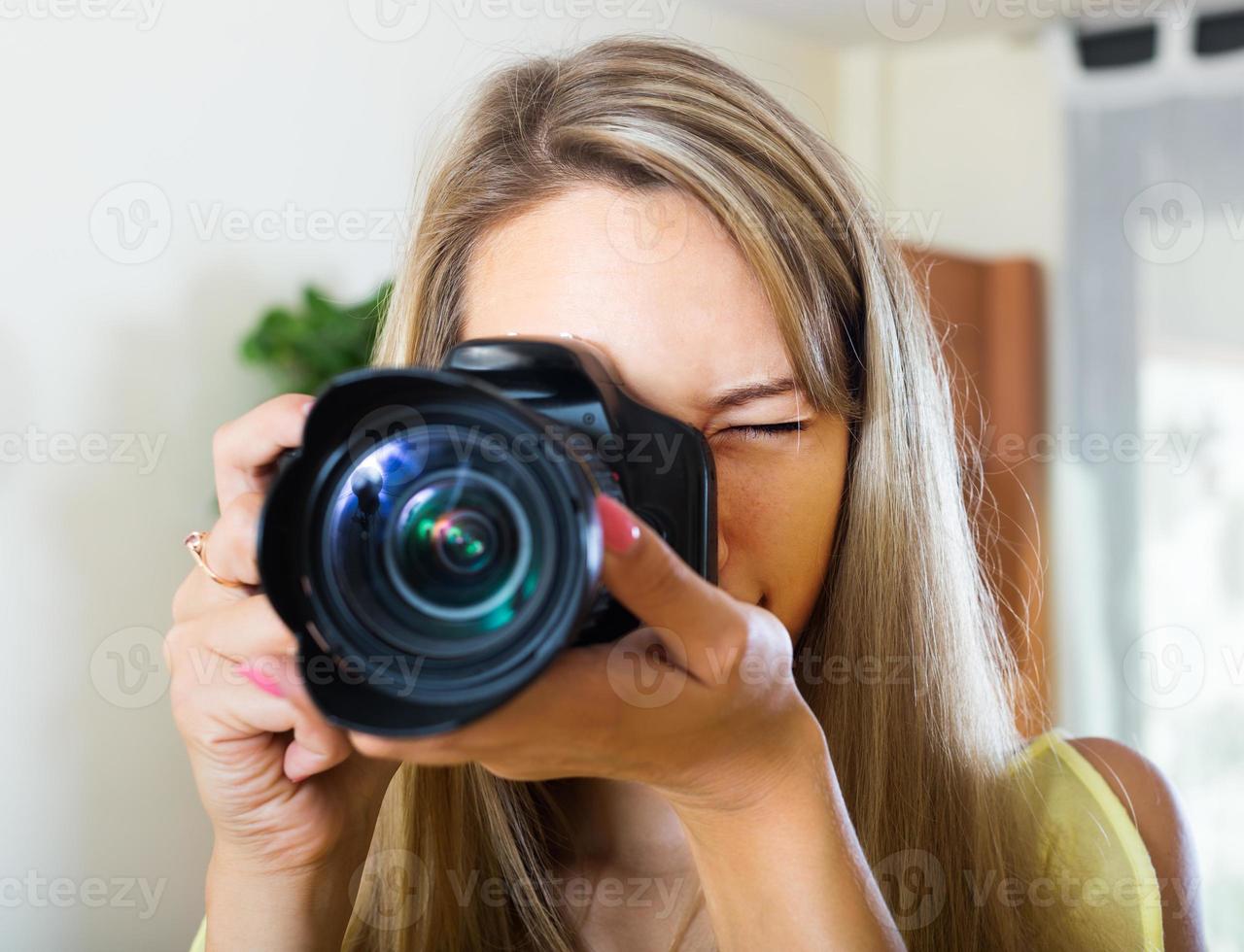 Young girl working with  photocamera photo