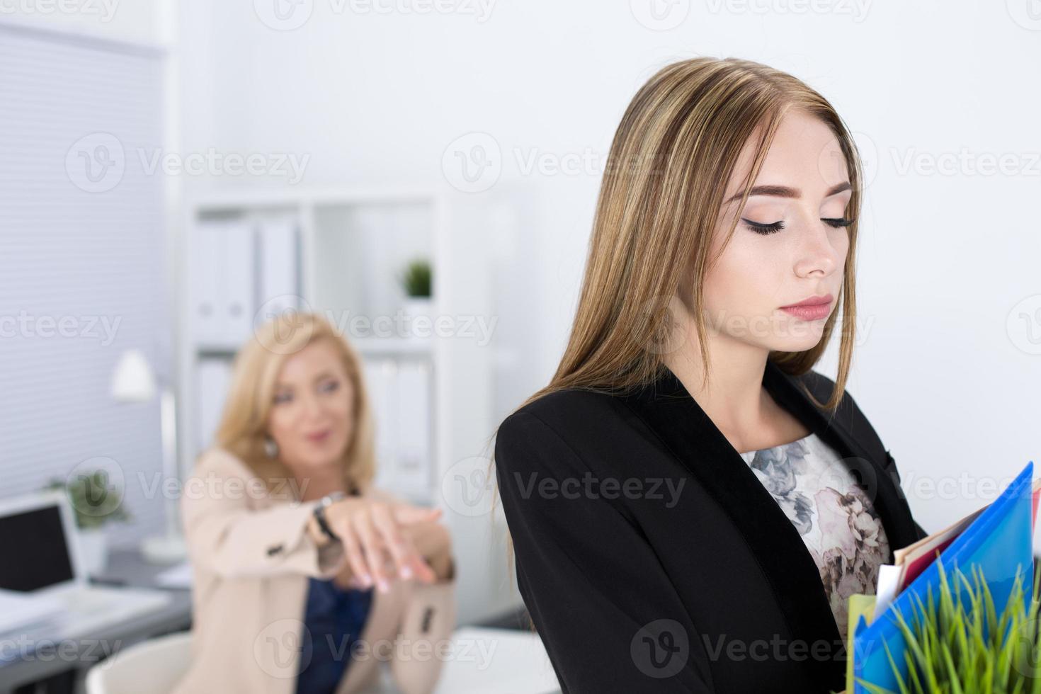 Boss dismissing an employee photo