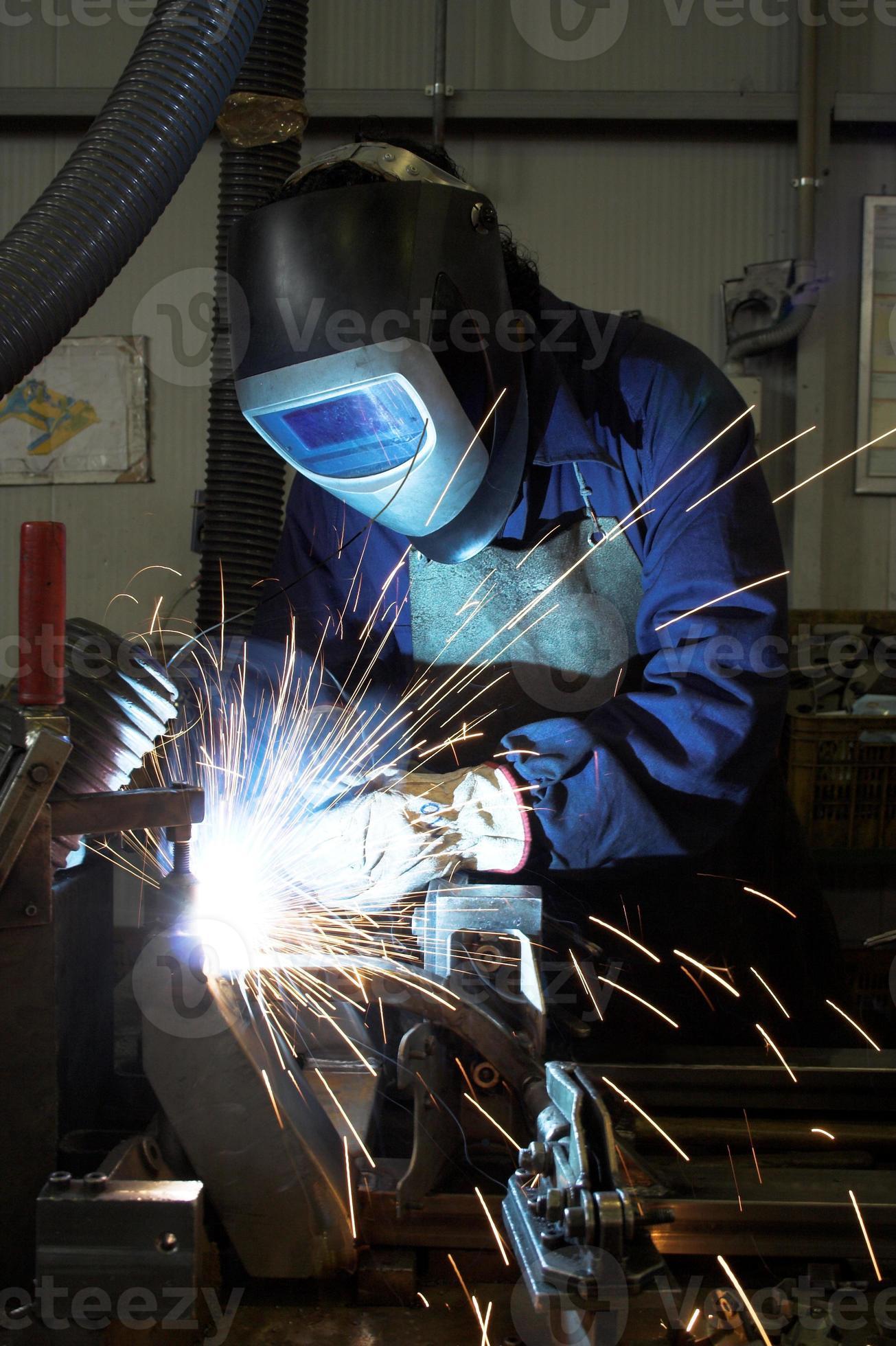 Welding a car chassis 907540 Stock Photo at Vecteezy