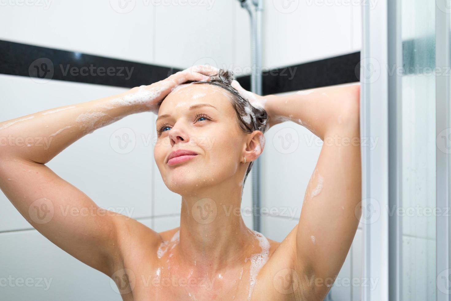 Young woman taking a shower 907857 Stock Photo at Vecteezy