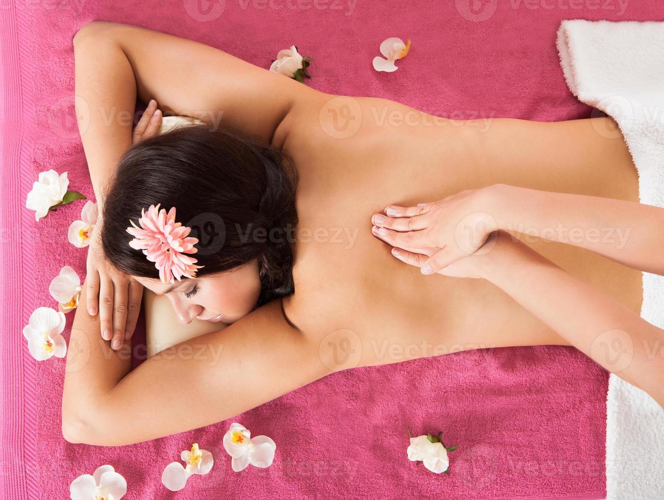 Woman Receiving Back Massage At Beauty Spa photo