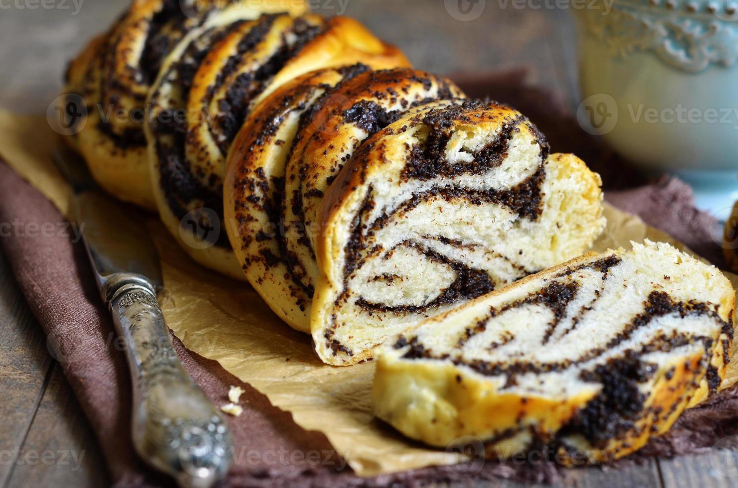 Yeast roll with poppy seed. photo