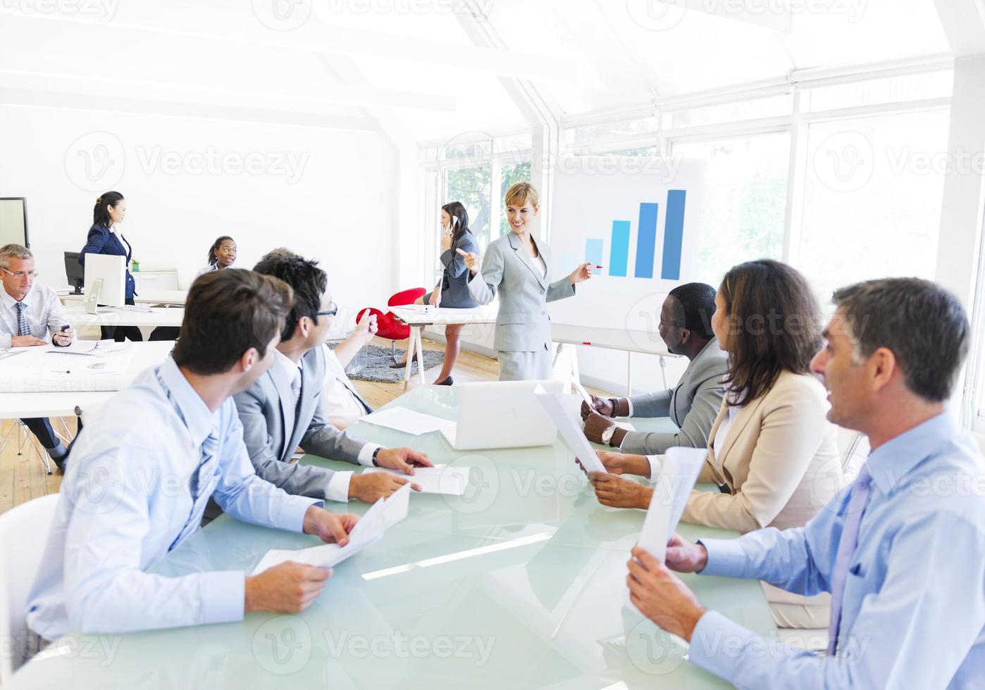 Business Presentation of a Corporate Woman to her Colleagues photo