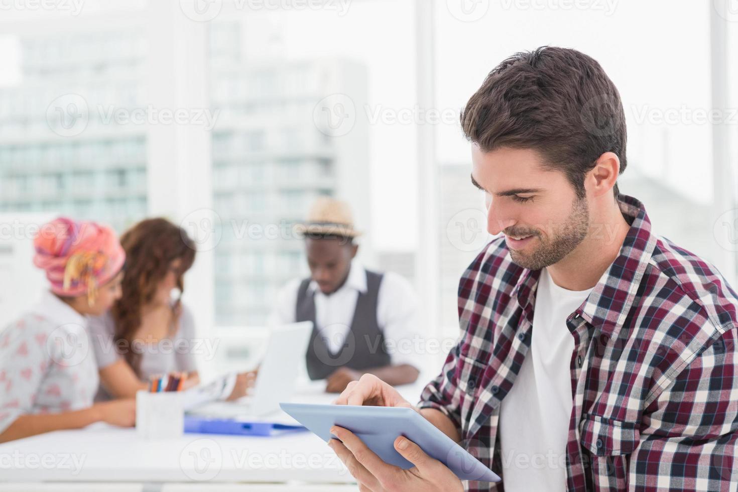 Casual businessman using digital tablet photo
