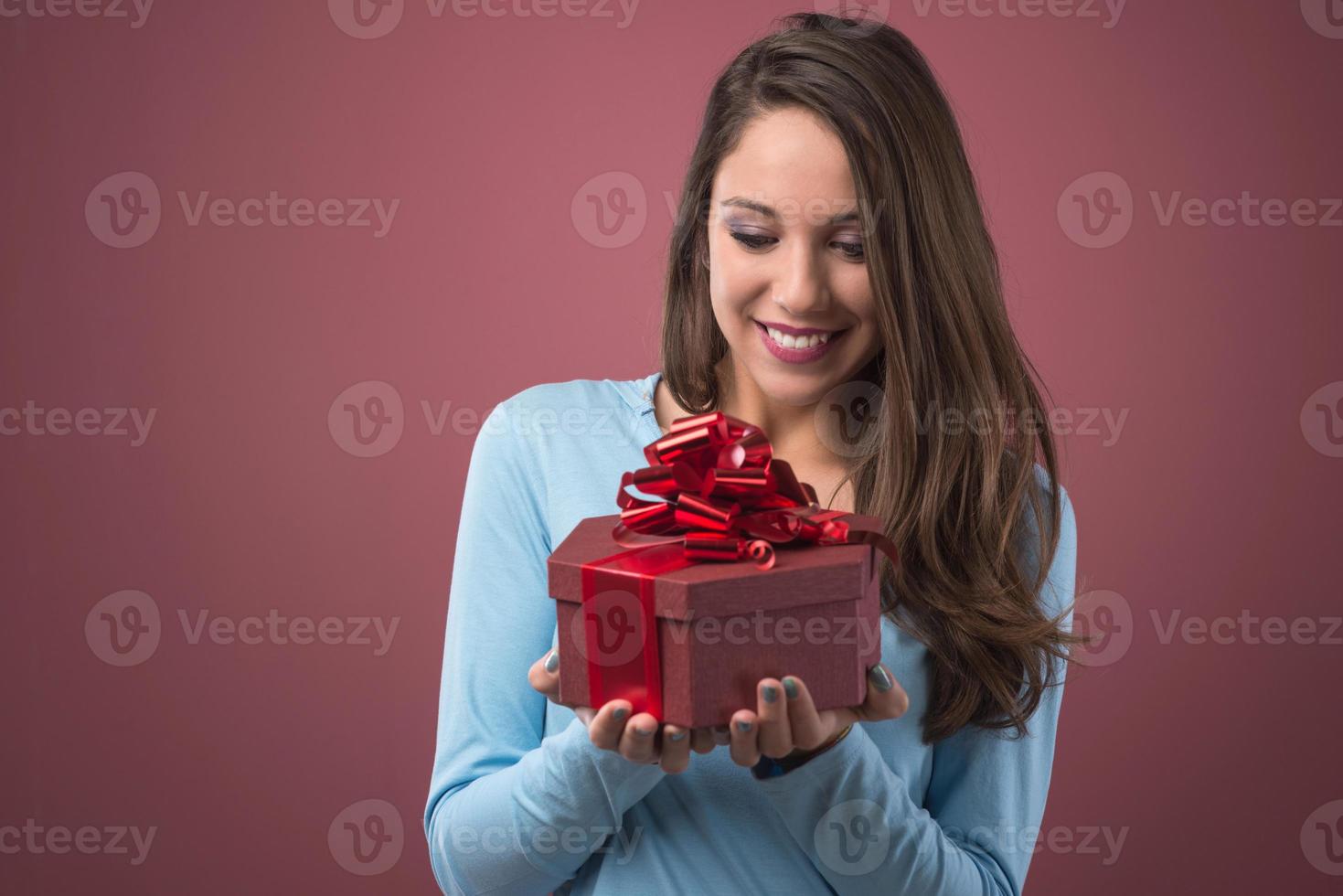 Joyful woman with gift box photo