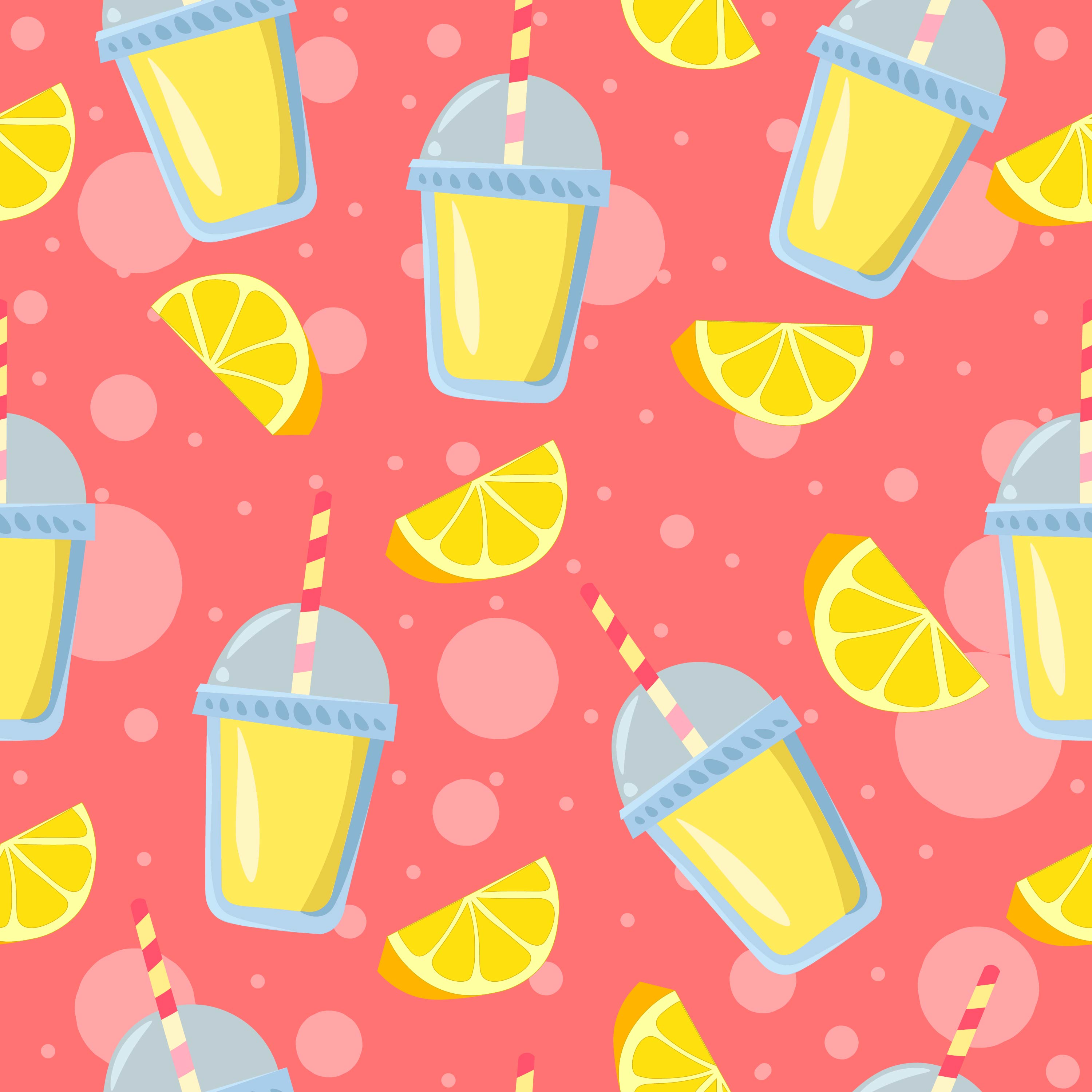 Lemon pieces and lemonade glasses with pink bubbles in the background