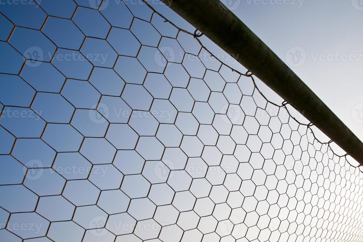 Soccer net with on blue sky background photo