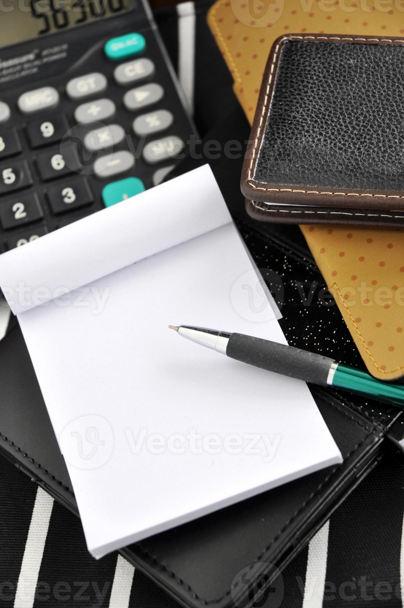 pen and paper with calculator on background 933346 Stock Photo at Vecteezy